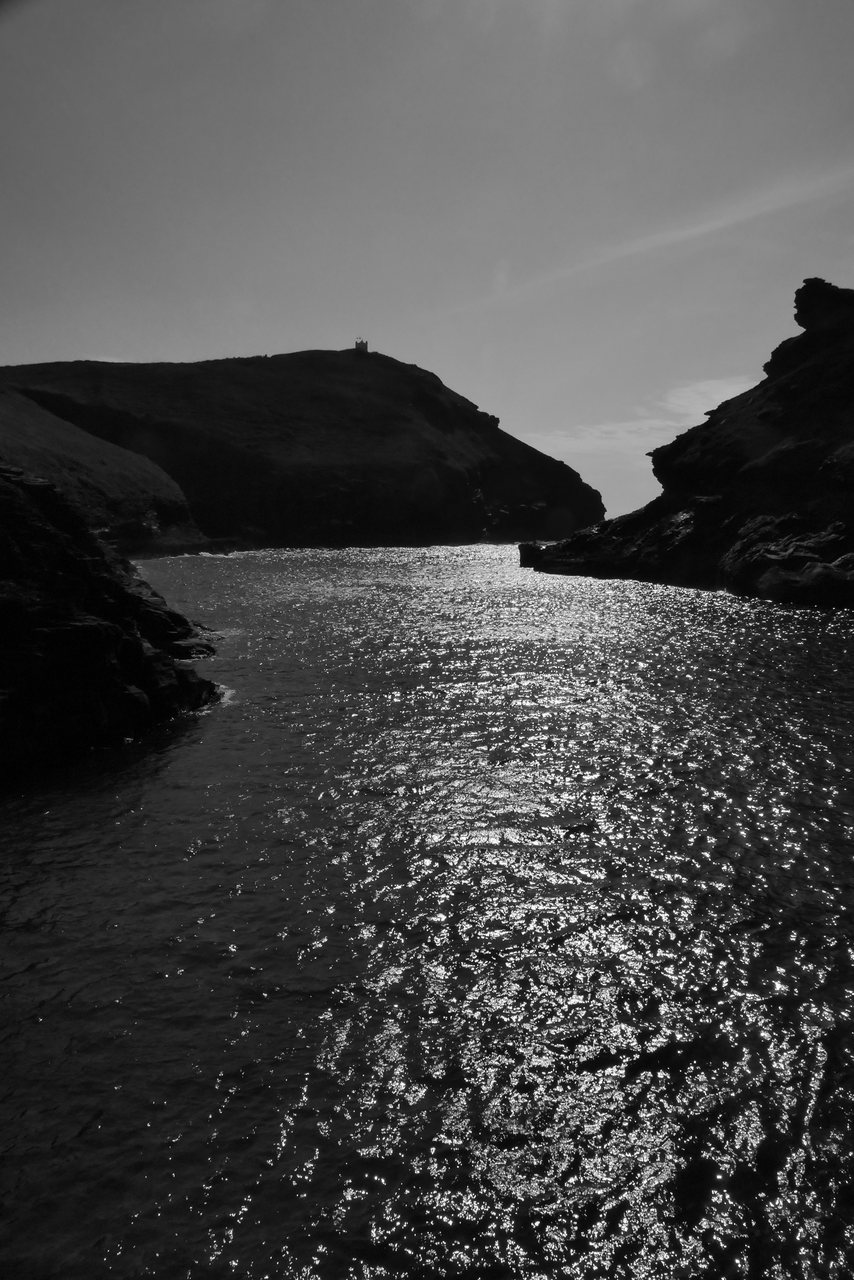 Harbour Light. Sun on the water at the harbour mouth.