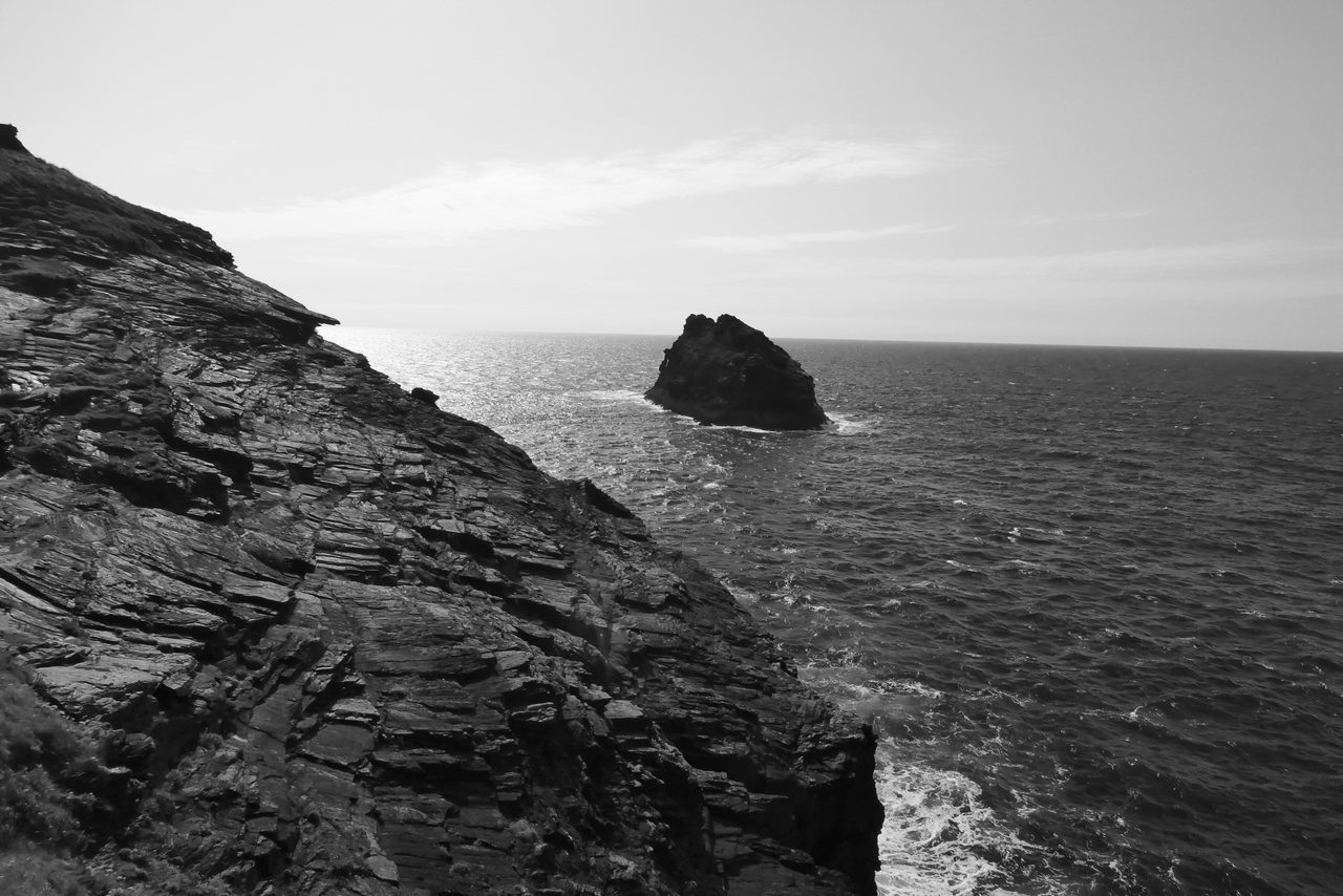 Offshore. A lone rock out in a bright, glittering sea.
